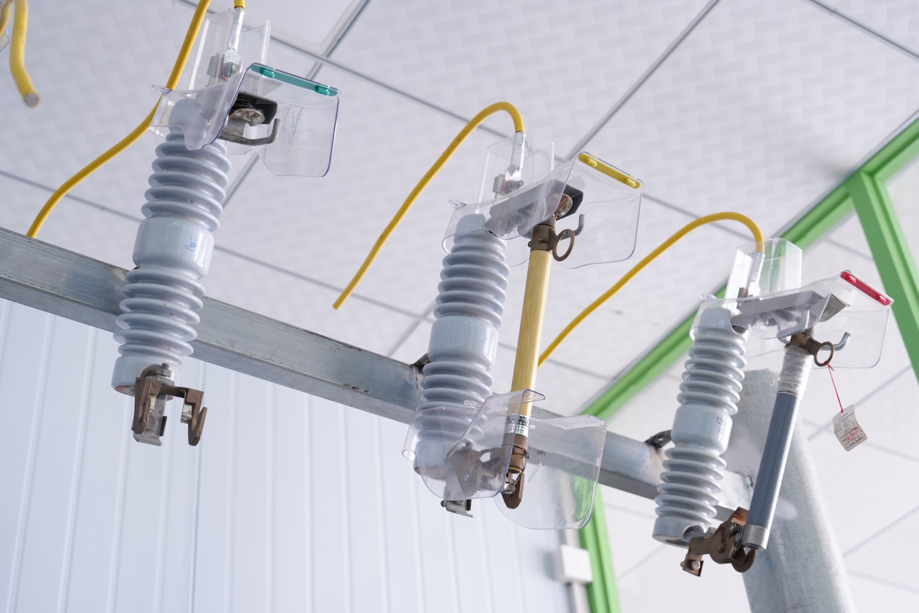 Phase-coded cover installed on fuse equipment